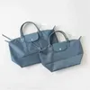 Lyxiga handväskor tjocka designer kvinnor äkta läderväska vikbar vattentät nylon hästväskor bolsas messenger bör toote