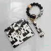 Pulsera de diseñador Bolso de tarjeta de cuero sólido Llavero de pulsera Pulsera con cuentas de silicona Brazalete de billetera con borla de cuero