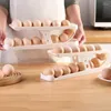 Garrafas de armazenamento suporte de rolamento automático rack geladeira caixa ovo recipiente cozinha dispensador organizador