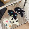 Chaussettes pour femmes, couleur noir et blanc, ligne épaisse, creuse, réduction de l'âge, mignonnes, filet rouge, tendance, pur coton