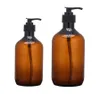 Leere Quetschflasche aus bernsteinfarbenem Kunststoff mit schwarzer Lotionspumpe, Probenbehälter für Körperlotion-Duschgelgläser 101 Unzen And1272923