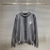 SWEATER MARKI MĘŻCZYZNA KOBIETA WŁAŚCIWOŚĆ KNITWEAR Luksus Trójkąt Logo Pullover Designer Top Sweters Okoła szyi Długie rękaw Azja Rozmiar S-XXL