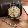 Relojes de bolsillo Reloj de bolsillo mecánico retro vintage The Polar Express Design Números romanos Esqueleto hueco Cadena de reloj de bolsillo mecánico para hombre 231208