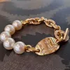 Designer de haute qualité 23 New Western Empress Dowager Diamond Oval Pearl Bracelet pour la mode féminine, petits objets artisanaux polyvalents, légers et haut de gamme