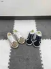 Scarpe firmate per bambini di marca scarpe da tavola per bambini in tela autunnale Taglia 26-35 Scarpe da ginnastica per ragazzi con stampa completa di lettere a griglia Dec05