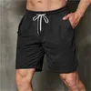 Pantalones cortos para hombres Carga casual para hombres Cintura elástica Todo fósforo Bolsillos sueltos finos Al aire libre Color puro Verano Fitness Pantalones deportivos Playa