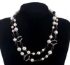 S925 Projektant biżuterii wisiorki Naszyjnik Eleganckie kobiety Czarno -biały łańcuch swetra Paris Mash