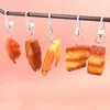 Schlüsselanhänger 1pc Simulation geschmorte Schweinebauch geröstete Hühnchenschlüsselkäse PVC -Lebensmittelmodell Kinder Spielzeug Frauen Bag Auto Keyring Telefon Grinktion Großhandel Großhandel