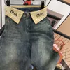 Jeans femininos de strass vintage com bainha Miu espessada e folgada, mostrando magreza e arrastando no chão 2023 outono e inverno novo estilo