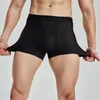 Shorts masculinos fitness alta elasticidade gelo malha olhos respirável secagem rápida super sem costura designi calças de dois quartos. Foto