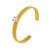 Braccialetti con polsini regolabili placcati in oro in acciaio inossidabile per donna Accessori per gioielli con braccialetto con motivo a corda intrecciata con zirconi