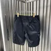 Herr shorts designer cinessd sommar mode personlighet triangel märke avslappnad multi-pocket arbetskläder 2023 snörning lös yk0v