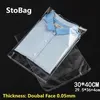 Stobag 100pcs 30 40 سم شفافة من البلاستيك اللاسلكي OPP قابلة للاستمتاع بأكياس ملابس السيلوفان القابلة للاستيلاء على حقيبة هدية تعبئة واضحة