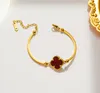 Enkel 18k guldpläterad designer charm armband enkel blomma vattentätt bevis fyrblad klöver smycken
