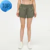 L-091 Short taille basse chaud respirant Yoga à séchage rapide Short de sport doublé intégré Fermeture éclair cachée Poches latérales encastrées Pantalon de survêtement de course avec Cont