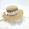 Sombreros de ala ancha Mujeres Gorra de sol nupcial Transpirable Verano Paja Sombrero de novia Perlas Carta Summerbeach Bonnet Poshoots Tocado