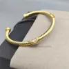 Bracciale Dy Filo intrecciato Testa tonda Braccialetti di lusso di design Cavo X oro argento Moda donna Versatile canapa placcata platino Tendenza spedizione gratuita di gioielli