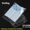 Stobag 100pcs 30 40 سم شفافة من البلاستيك اللاسلكي OPP قابلة للاستمتاع بأكياس ملابس السيلوفان القابلة للاستيلاء على حقيبة هدية تعبئة واضحة