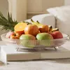 Tallrikar Modern Fruit Dish Design Elegant Light Luxury Transparent Plate med öppning av elektropläterade fötter för rumskaffe