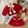 Set di abbigliamento Set per bambini Ragazza in stile coreano 2023 Fiocco invernale in peluche Cappotto e gonna di lana rossa Principessa Dolce Casual in due pezzi