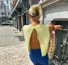 Kvinnors tröjor gul stickad o-hals ärmlös beskuren topp väst sexig backless spetsar upp avslappnad elegant pullover 2023 Summer Autumn Chic