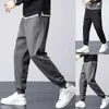 Pantalones para hombres Deportes al aire libre Hombres Sweetpant Jogger Transpirable y suave Pantalones sueltos Longitud del tobillo Ropa diaria Negro / Gris