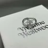 デザイナーViviene Westwoods New Viviennewestwood 23春/夏ニューウエスタンエンプレスダウガーサターンクロスリング女性マイノリティデザインダイヤモンドプラネットリングでいっぱい