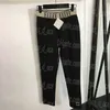 Pantaloni leggings con fettuccia a lettera Pantaloni neri alla moda da donna Pantaloni legging quotidiani da donna casual