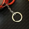 مصمم مفتاح سلسلة Colormania Mini Pouch Womens Luxury Keyring الفولاذ المقاوم للصدأ الفولاذ المقاوم للصدأ كيس كلاسيكي