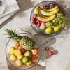 Tallrikar Modern Fruit Dish Design Elegant Light Luxury Transparent Plate med öppning av elektropläterade fötter för rumskaffe