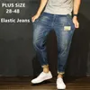 Jeans masculinos preto jeans homens denim azul jean angustiado meninos jogger calças hip hop harem estiramento masculino adolescente calças plus size 42 44 46 48 q231213