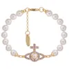 Designer Vivine Westwood Nouveau VivienneNewestwood 23 Western Empress Dowager Hollow Saturn Pearl Bracelet Womens French Classic Planet Cross Pearl Bracelet 59565