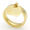 Joyería de moda 316L Anillos en forma de corazón chapados en oro de titanio Letras T Anillo de corazón doble Anillo femenino para mujer289u