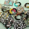 Bracelet de perles en Silicone, sac de cartes, pompon en PU, vache, style occidental, portefeuille pour femmes, porte-monnaie en cuir léopard, porte-clés P184
