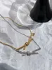 Designermerk Gu Ailings Cross Knot ketting met dezelfde stijl voor dameslicht luxe en uniek ontwerp Een hoogwaardige gouden elegantie beroemdheidskraag met logo