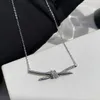 Designermerk Gu Ailings Cross Knot ketting met dezelfde stijl voor dameslicht luxe en uniek ontwerp Een hoogwaardige gouden elegantie beroemdheidskraag met logo