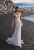 Maniche da sposa Abito da spiaggia in pizzo Corte dei treni Illusion Back Abiti da sposa lunghi sexy Vestido De Novia Splendido abito bohémien color avorio e nudo