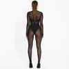 Kvinnors jumpsuits Rompers Autumn Winter 2023 Mesh Se genom Black Bodycon Jumpsuit Ropmers kvinnor Sexig långärmad enstaka festklubb overaller outfitsl231212