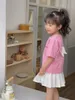 Ensembles de vêtements Baby Girls Costume à manches courtes 2023 Enfants Mode Vêtements d'été T-shirt à ailes stéréoscopiques Tops mignons Jupe plissée 2 pièces Ensemble