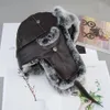 Traper Hats Style Real Rex Rabbit Fur Bomber na zewnątrz zimowy ciepły Unisex Rosyjski kapelusz Ushanka z klapką ucha 231213