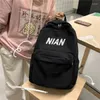 Bolsas escolares de color sólido japonés mochila minimalista mochila escolar mujeres versátiles impermeables para hombres