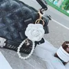 Mode Bowknot Kamelie Schlüsselbund Kreative Perle Kette PU Leder Rose Blume Tasche Auto Schlüsselbund Anhänger Zubehör