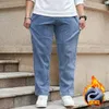 Jeans masculinos plus size 46 48 inverno veludo gordo velo quente denim reto calças de pernas largas 200kg calças de quatro estações