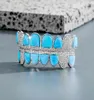 14K CZ Vampire Teeth Grillz Iced Out Micro Pave Kubieke Zirkoon BLAUW Opaal 8 Tand Hip Hop Grill Top Bottom Mond Grills Set met Sili3350826