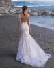 Maniche da sposa Abito da spiaggia in pizzo Corte dei treni Illusion Back Abiti da sposa lunghi sexy Vestido De Novia Splendido abito bohémien color avorio e nudo