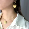 Adornos colgantes de amor populares, pendientes de collar en forma de corazón versátiles de moda chapados en oro de acero de titanio, conjunto de dos piezas Y2K europeo y americano