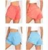 Kvinnor Yoga kläder Kort fodrade löpande shorts med dragkedja i fickan Gym Ladies Casual Sportswear For Girls Training Fitness Tidal 2720839