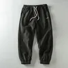 Pantaloni da uomo stile America in pile addensato lettera ricamo sport invernali tinta unita elastico in vita pantaloni quotidiani per giovani