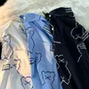 Camicette da donna camicia giapponese camicia di nicchia di nicchia cartone animato stampare a maniche lunghe Top 2023 autunno oversize unisex show blusa bianca