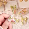 Decoraciones de arte de uñas 50 piezas 3D aleación arco diseño de belleza oro plata Bowknot Rhinestone brillantes encantos 9X15 mm cinta manicura adornos de joyería